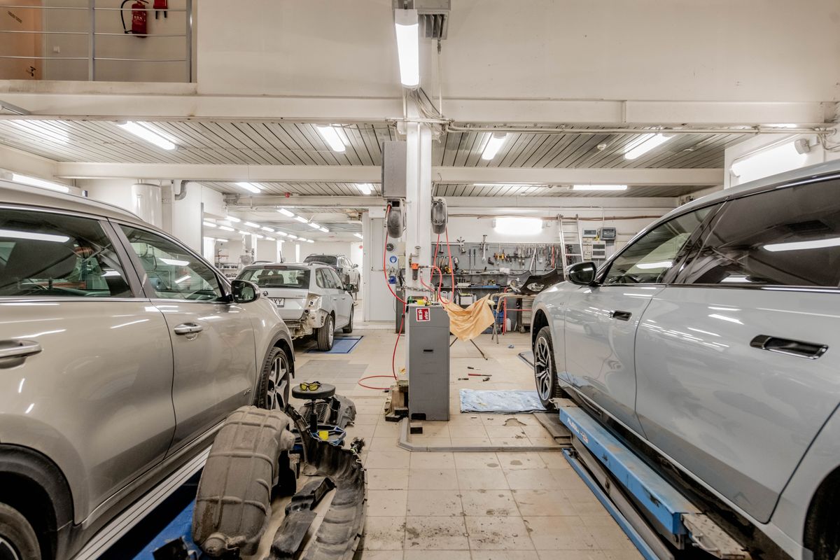 Cars on ramps in the DVSA-approved MOT station